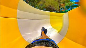 Yellow Body Slide at AquaJoy Water Park